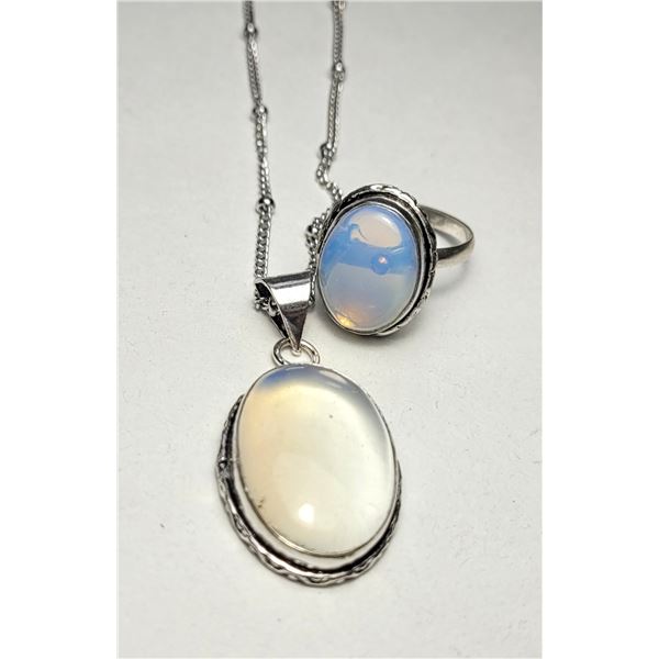 11)  NATURAL OPALINE SIZE 8 OVAL BEZEL SET
