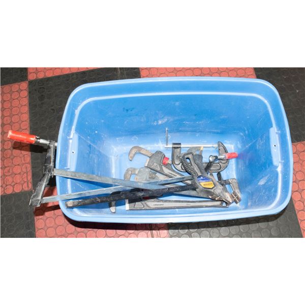 TOTE WITH PIPE WRENCHES AND CLAMPS