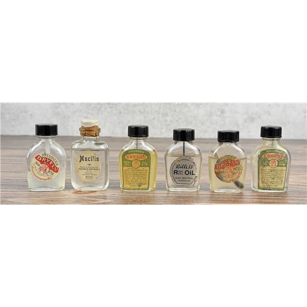 Group of Fishing Reel & Dry Fly Oil Bottles