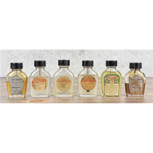 Group of Fishing Reel & Dry Fly Oil Bottles