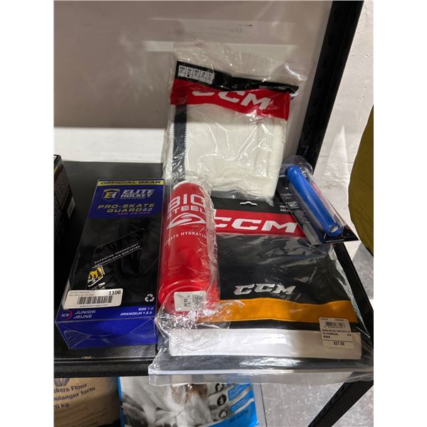 Lot Of Hockey Accessories Including CCM Socks, Elite Hockey Guards, and Biosteel Bottle