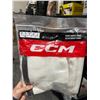 Image 5 : Lot Of Hockey Accessories Including CCM Socks, Elite Hockey Guards, and Biosteel Bottle