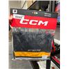 Image 7 : Lot Of Hockey Accessories Including CCM Socks, Elite Hockey Guards, and Biosteel Bottle