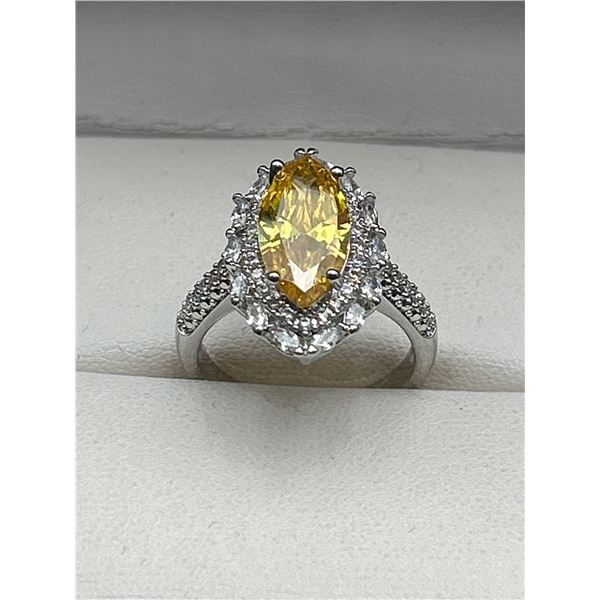 Marquise-Cut Yellow Gemstone Ring with Clear Stone Accents in Silver Setting