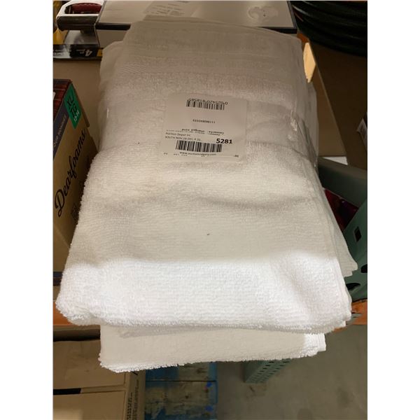 White Cotton Towels with Product Tag Displayed