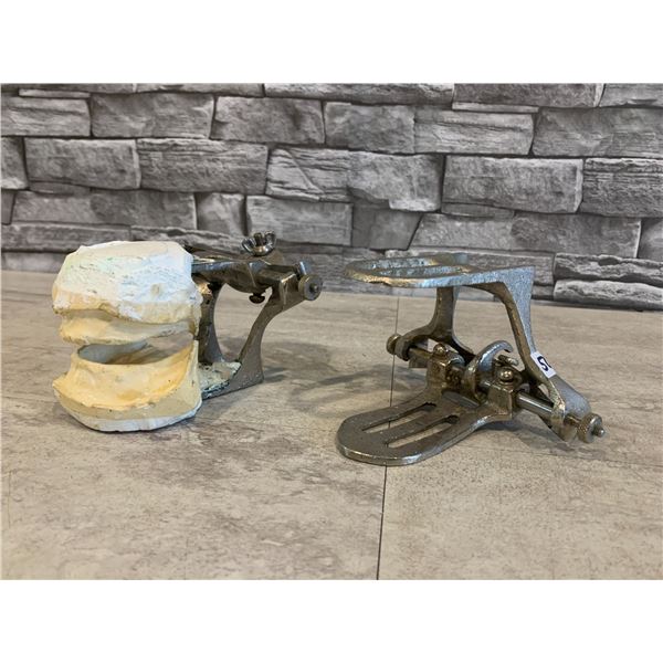 Lot of 2 Dental Articulators - One with Plaster Cast Mounted in It