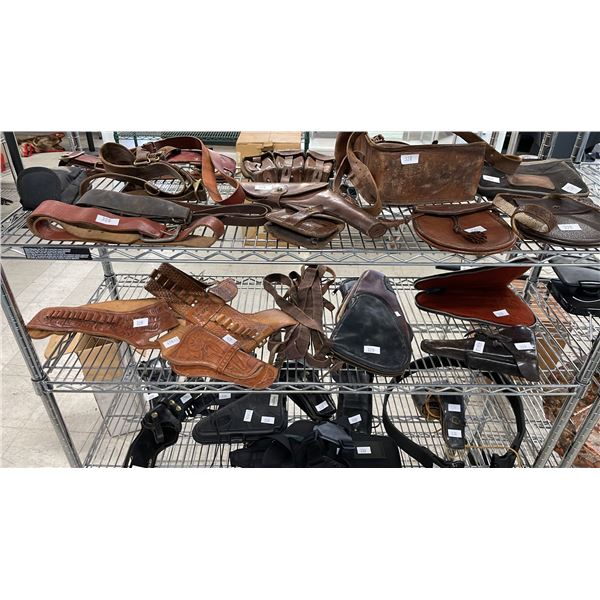 SHELF OF ASSORTED HOLSTERS & AMMUNITION BELTS
