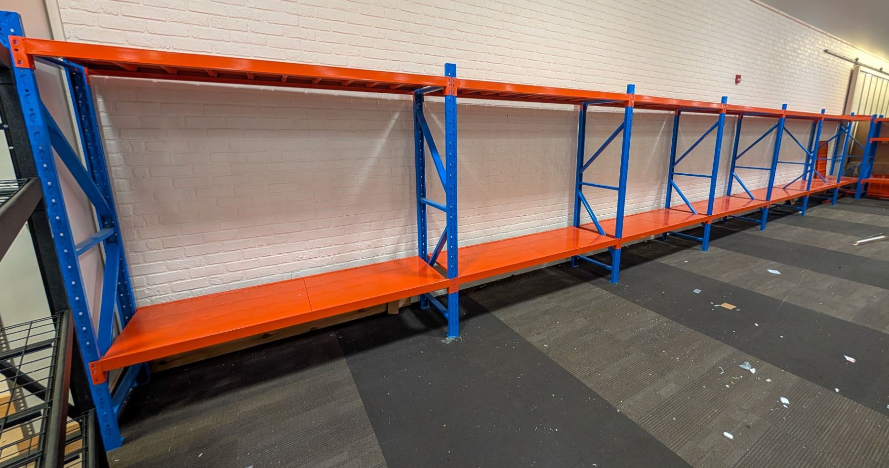 7 SECTIONS OF BLUE & ORANGE RACKING APPROX