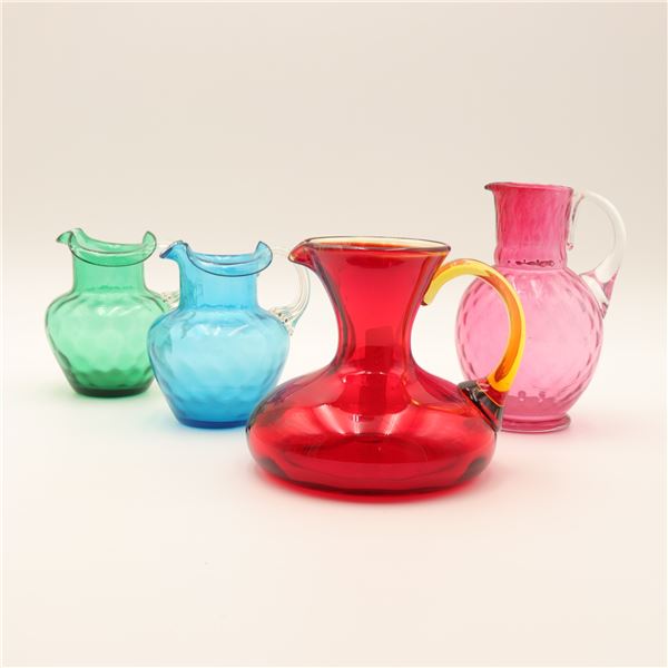 Group of Four Mid-Century Blown Art Glass Pitchers in Colored Optic Glass