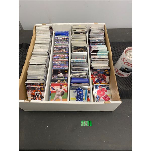 Large box of collector's sports cards featuring both hocket and baseball