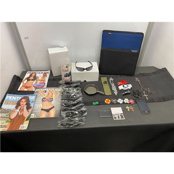 Assorted items including Penthouse magazines, sunglasses, poker chips, cell phone and more