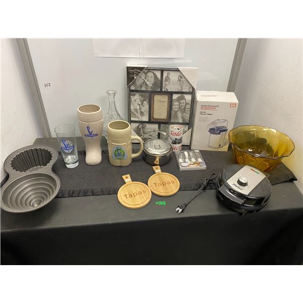 Lot of home items including sandwich press, cake pans, mugs, hot air popcorn machine and more