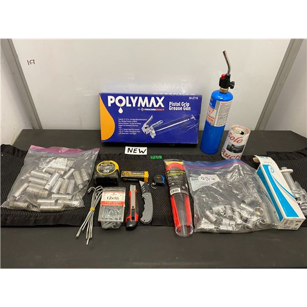 Lot of hand tools including caulking gun, measuring tape, sockets and more