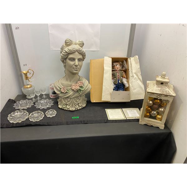 Assortment of home décor items including bust, porcelain doll, Christmas tree ornaments and more