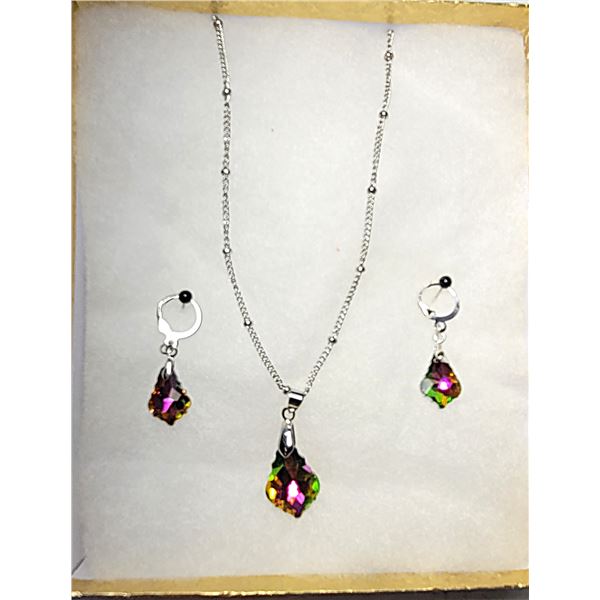 12)  SILVER TONE WITH BAROQUE CUT RAINBOW