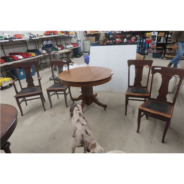 Round Oak Dining Table With Four Chairs, Including One Captain’s Chair - Height 30", Diameter 42"
