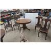 Image 1 : Round Oak Dining Table With Four Chairs, Including One Captain’s Chair - Height 30", Diameter 42"