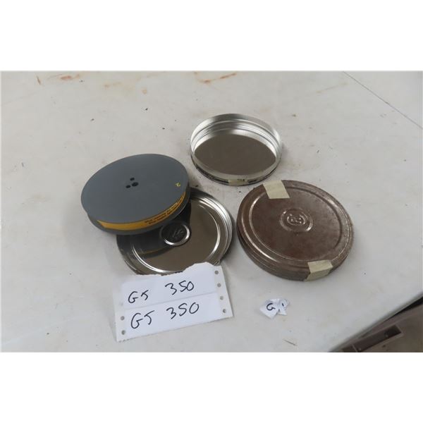 Two Metal Film Containers, One Containing Film