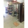 Image 5 : Glass Display Case With Three Glass Shelves Measuring 63 1/2" x 14 1/2" x 16 3/4"