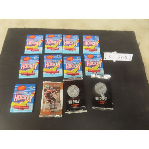 Twelve Factory-Sealed Hockey Card Packs Including 1991–92 O-Pee-Chee, 1999 Upper Deck Retro