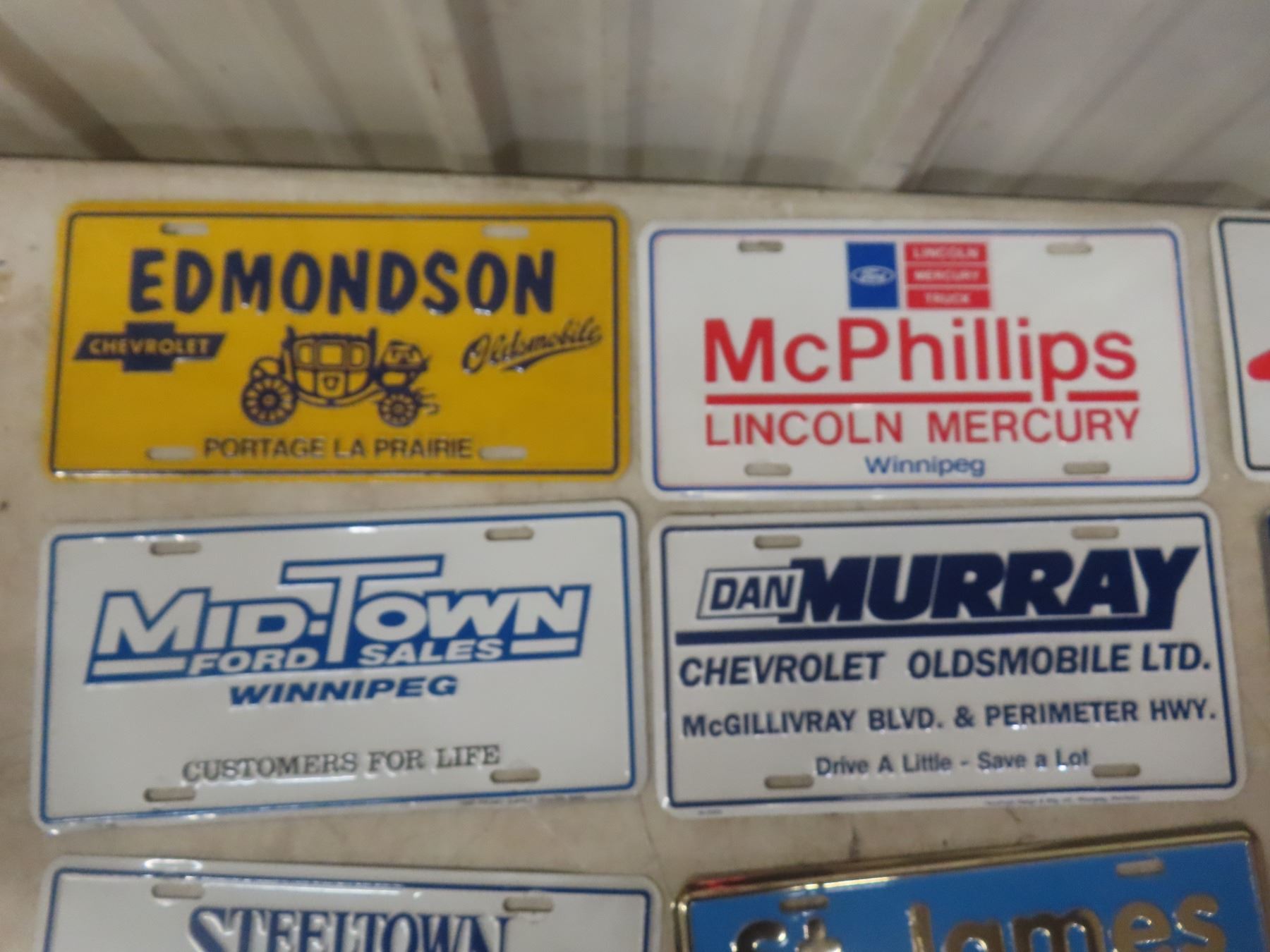 License Plate Emblems Assorted License Plates and Chrome Auto Emblems