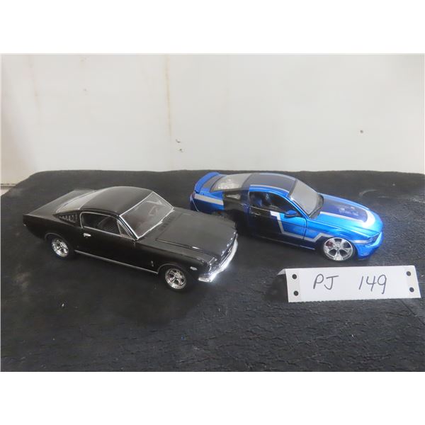Two 1/24 Scale Die-Cast Cars Including 1965 Mustang and 2011 Mustang