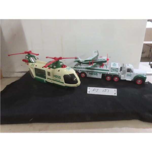 Four Hess Vehicles Including Semi, Airplane, and Helicopter