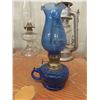Image 8 : Four Oil Lamps, Lantern, Extra Chimneys, and Glass Jug