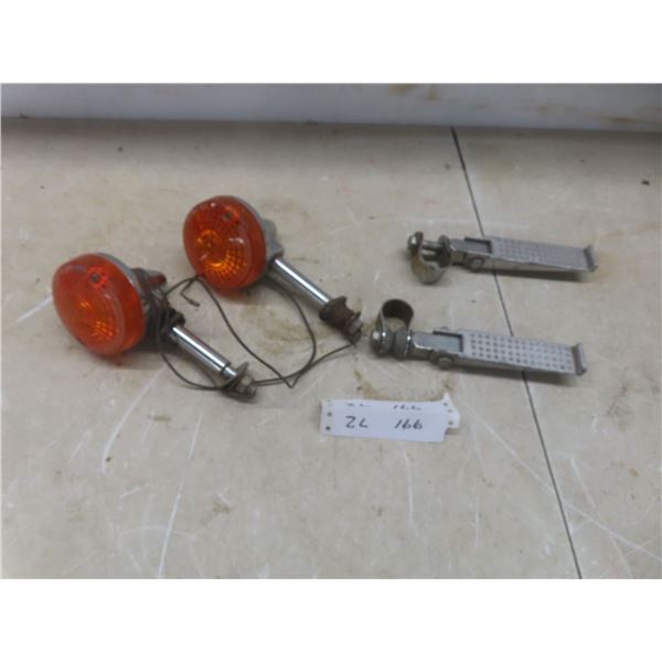 Two Motorcycle Foot Pegs and Two Turn Signal Lights