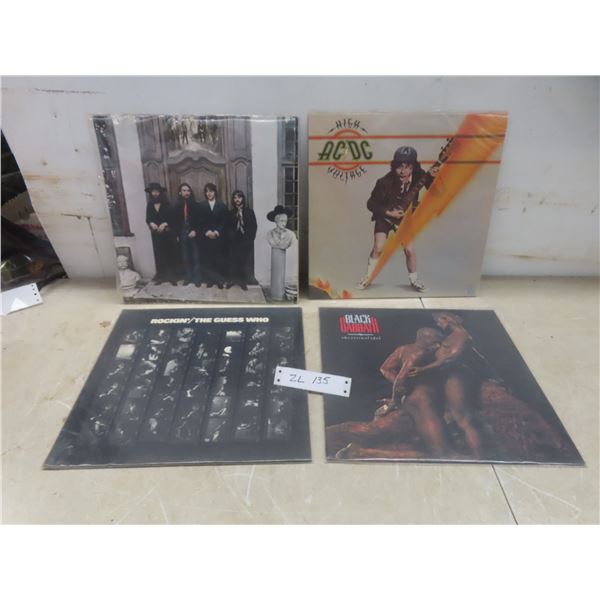 Four Rock Albums Including AC/DC, The Guess Who, Black Sabbath, and The Beatles