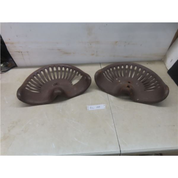 Two Vintage Cast Tractor Implement Seats