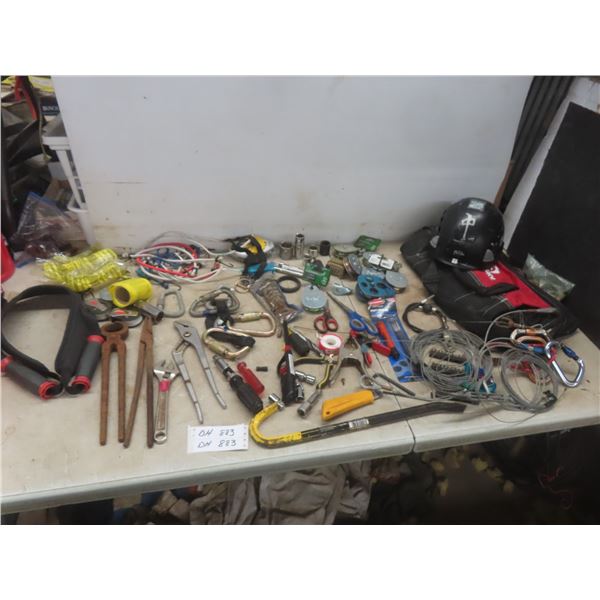 Husky Tool Bag Filled With Pulleys, Bungee Cords, Allen Keys, Wire, And Safety Glasses