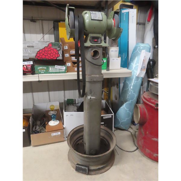 Six-Inch Bench Grinder Mounted On Steel Post + Tire Rim