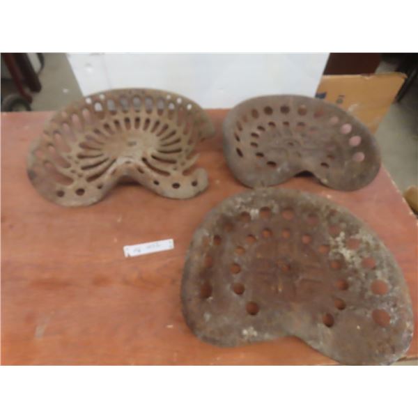 Three Vintage Tractor or Implement Seats, Two Metal and One Cast