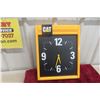 Image 1 : CAT Plastic Battery Clock, Measuring 13" x 16 1/2"