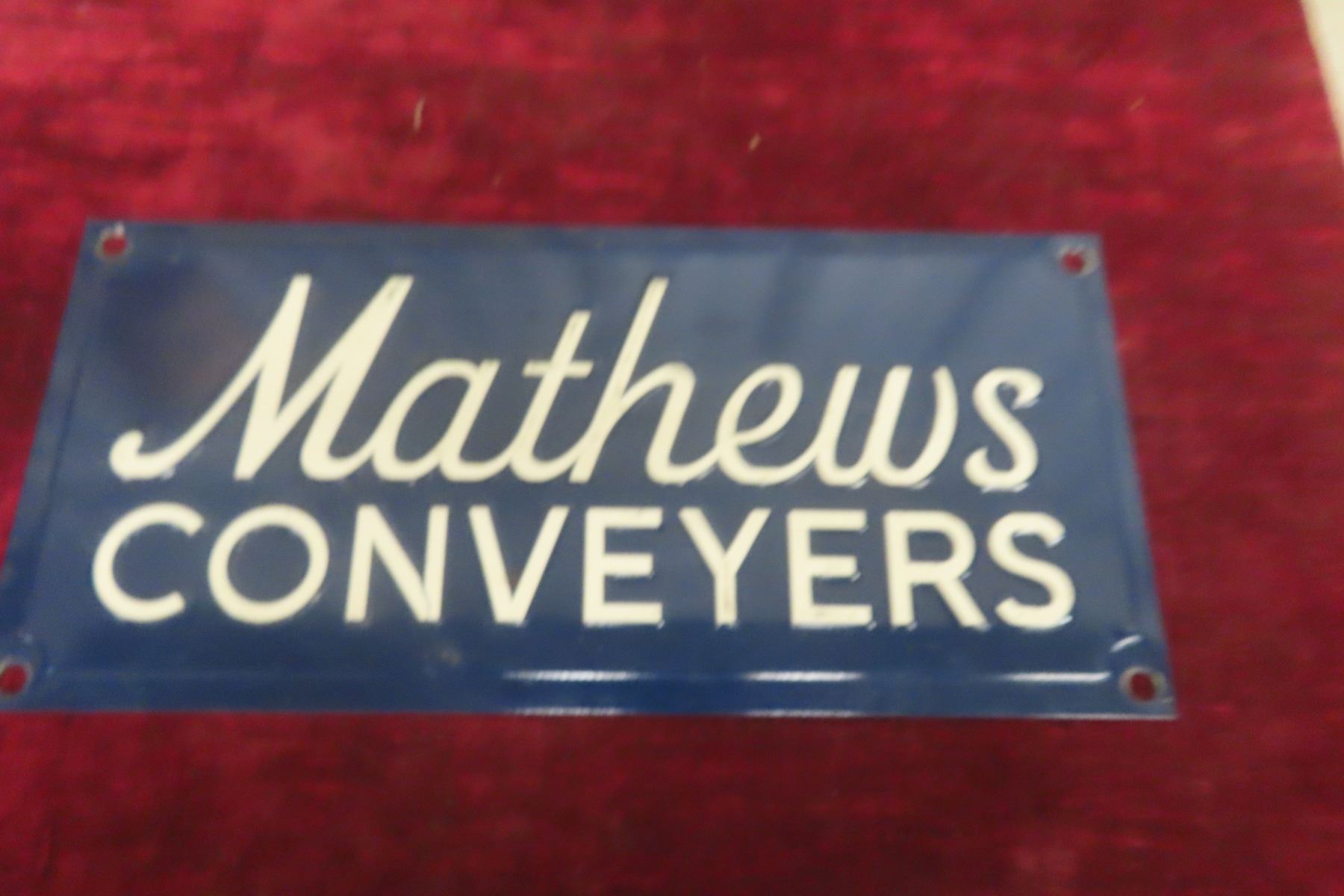 Mathews Conveyors Embossed Metal Sign