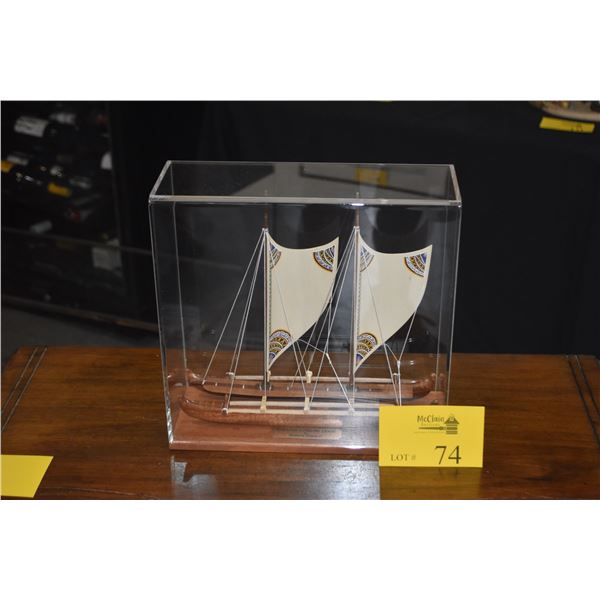 12" VOYAGING CANOE W/HAND PAINTED SAILS BY FRANCIS PIMMEL IN SHOWCASE