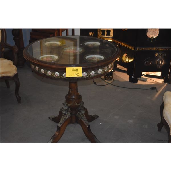 ANTIQUE PARLOR/TEA TABLE W/GLASS TOP, CARVED WOODEN BASE & INSET PORCELAIN PLAQUES