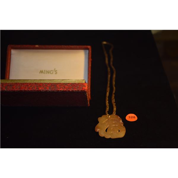 MING'S BROCADE NECKLACE W/CARVED "LUCKY" STONE PENDANT W/10K BALE; SIGNED W/MING'S BOX (27")