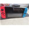 Image 10 : Nintendo Switch Game System With Charger, Case, Three Games, and Memory Card, Tested and Working