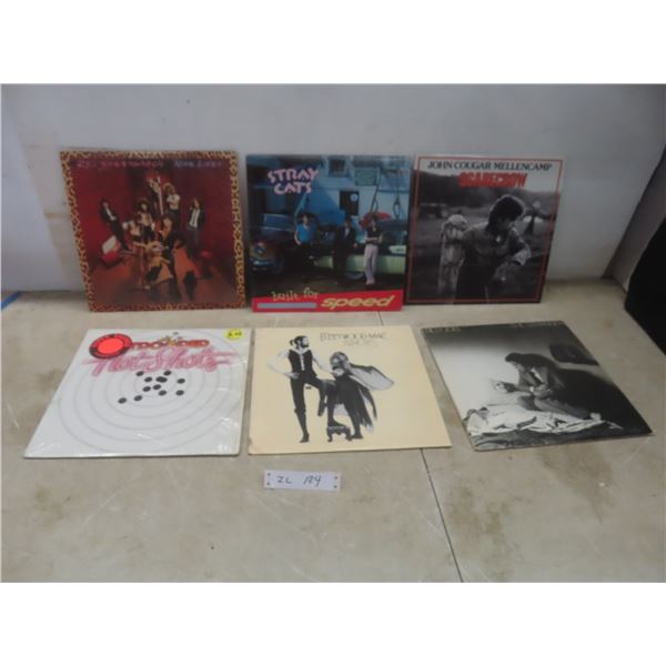 Six Vinyl Albums Including REO Speedwagon, John Cougar Mellencamp, Trooper, and Fleetwood Mac