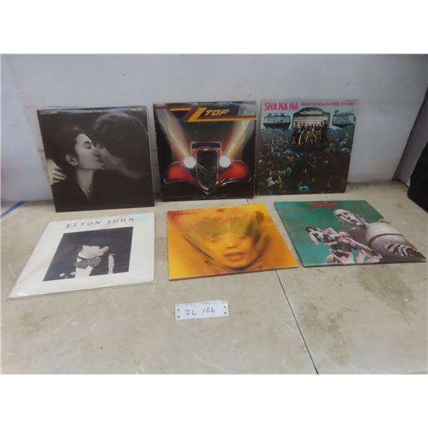 Six Vinyl Albums Including ZZ Top, The Rolling Stones, Queen, and John Lennon