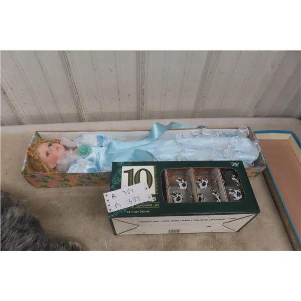Porcelain Doll and Ten New Glasses With Cows