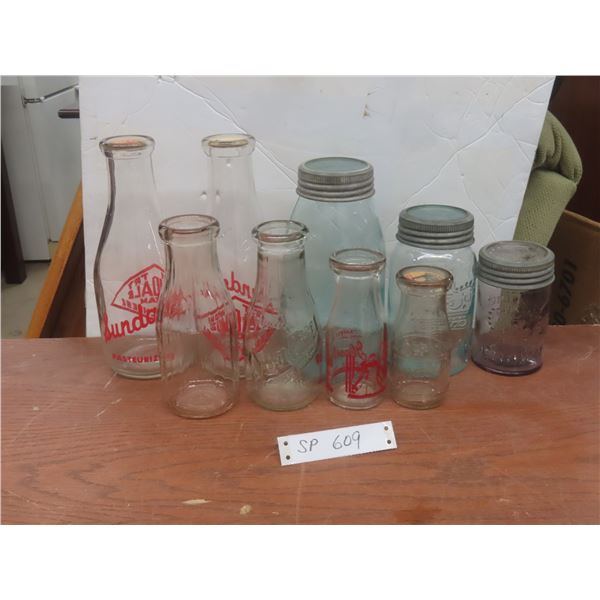 Six Vintage Embossed Milk Bottles and Three Glass Sealers Marked Eaton's Toronto Winnipeg