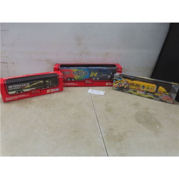 Three NASCAR Racing Champions Transporters Including Interstate Batteries, Maisto 1/64 Scale, and D