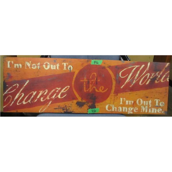 "NOT OUT TO CHANGE THE WORLD" SIGN (APPROX. 12" X 36")