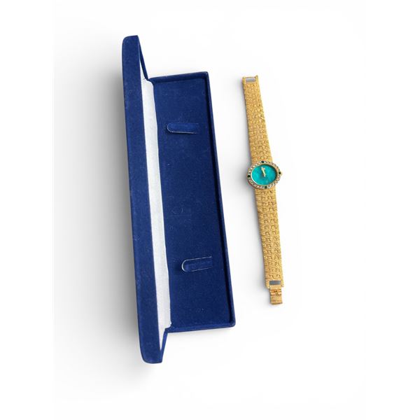 Camrose & Kross, JBK collection lady's analog quartz battery operated watch with a green dial, in go