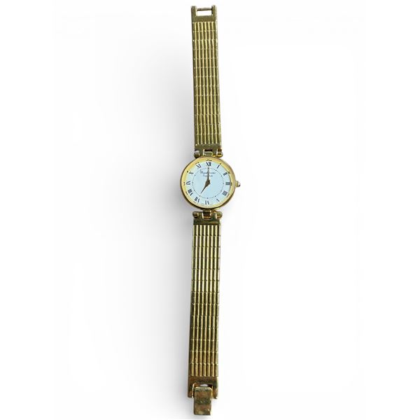 Gold tone "Marcel Drucker Signature" watch with white dial and bright gold tone bracelet.  - Apprais
