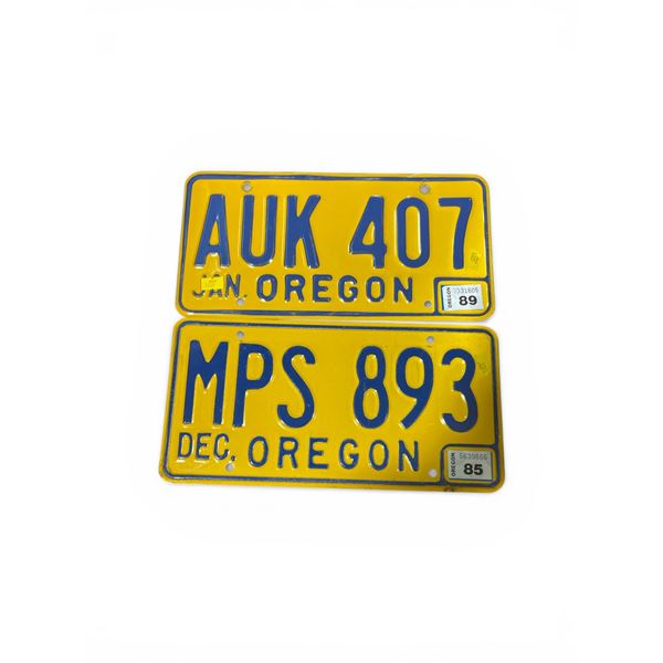 2 Vintage Oregon License Plates: MPS 893 (Dec 1985) and AUK 407 (Jan 1989)