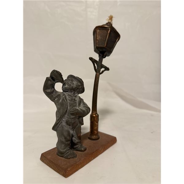 Vintage drunkard under lamp post oil lamp